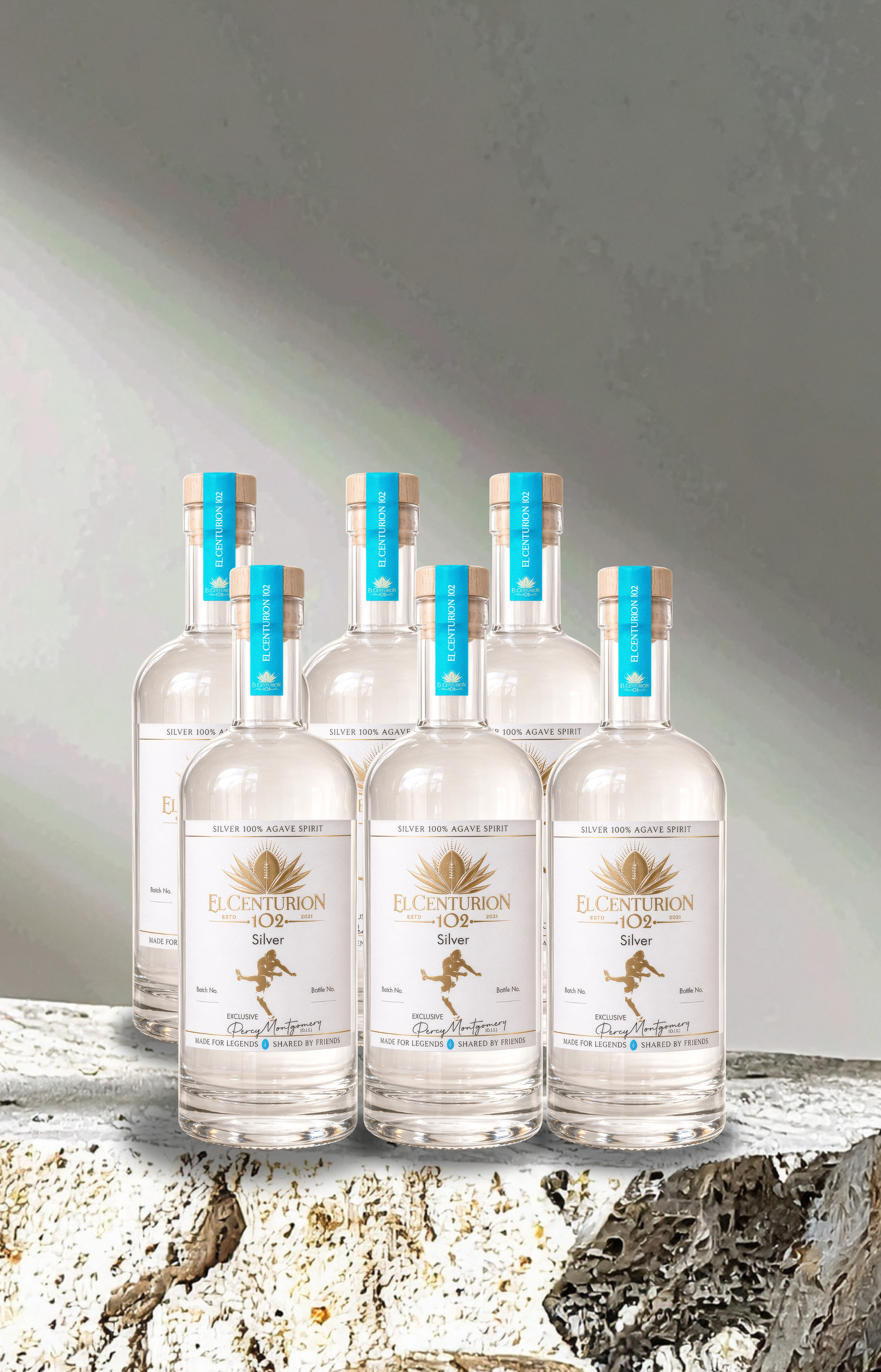 Six bottles of elcenturion102 on a textured surface with a neutral background