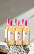 Six bottles of El Centurion 102 with pink labels on a stone surface.