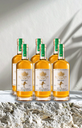 Bottles of El Centurion 102. on a textured surface with a neutral background